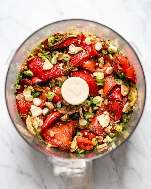 Ingredients are placed in a food processor and photographed from the top view