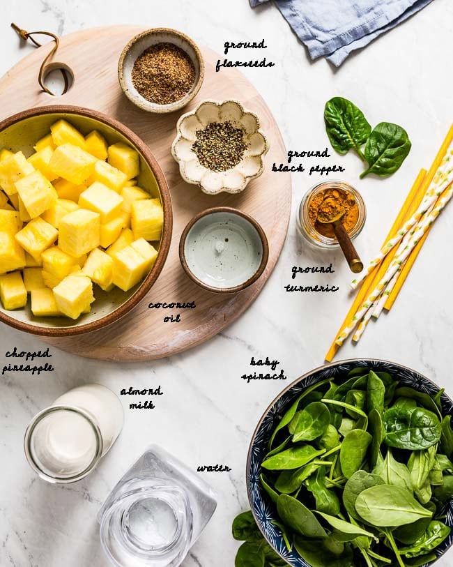 Ingredients for Green Smoothie with Turmeric are photographed from the top view.