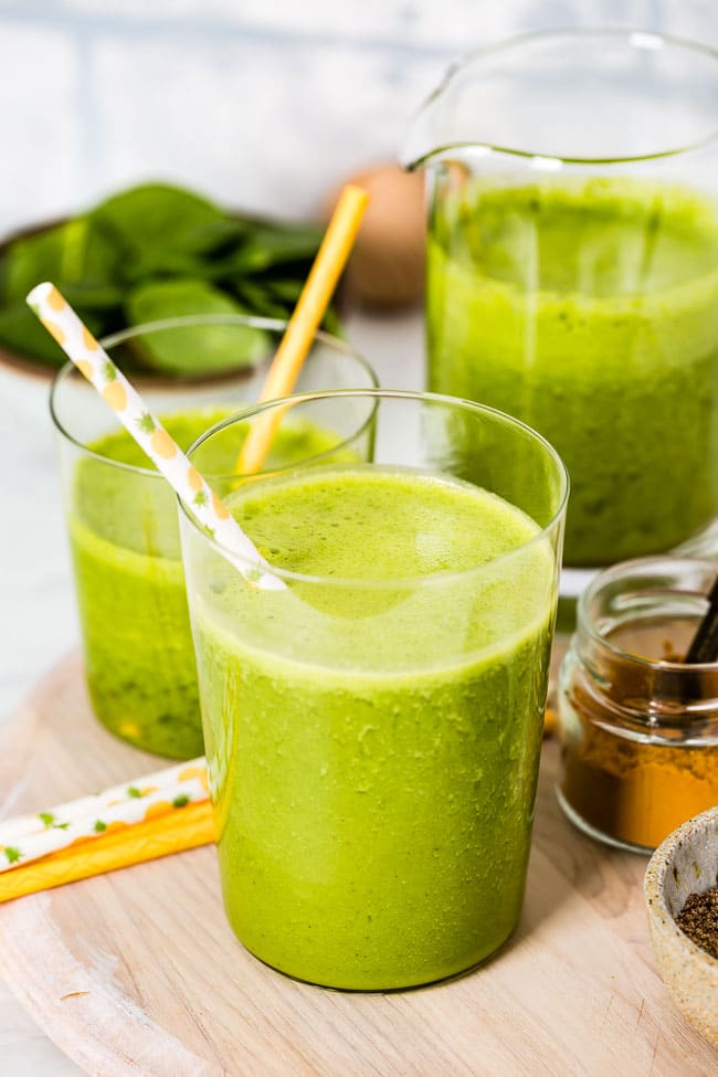 Three glasses of Turmeric green smoothie are photographed from the front view.