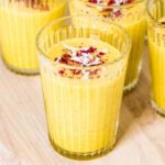 A few glasses of Mango Turmeric Smoothie recipe photographed from the front view