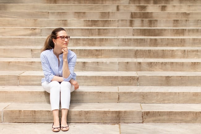 Aysegul Sanford is sitting on the stairs.