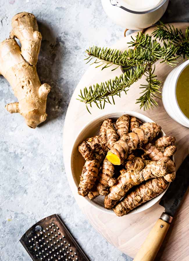 Fresh turmeric root, fresh ginger root photographed from the top view.