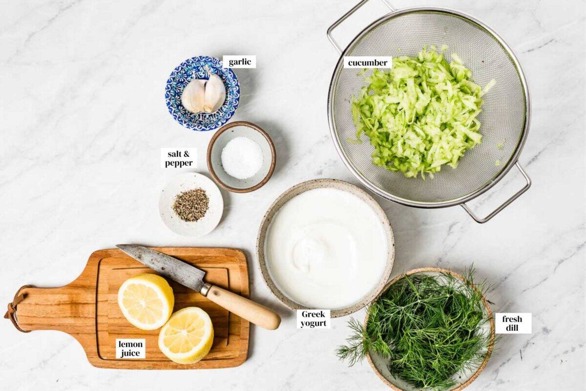 Tzatziki sauce ingredients from the top view with text on the image.