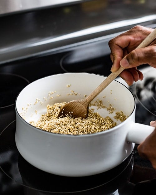 Toasting quinoa with spices to bring out its flavors