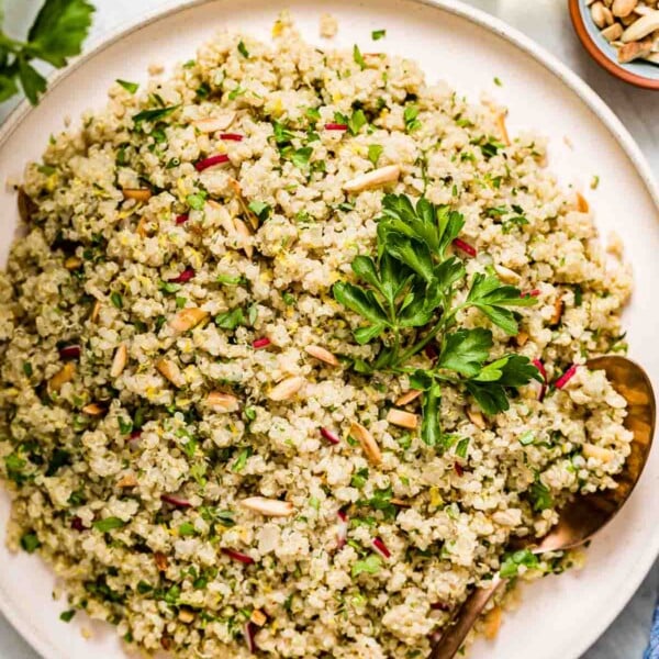 A plate of herbed lemon quinoa garnished with parsley