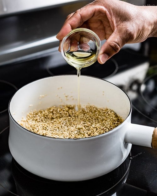 Adding oil to create a flavored and seasoned recipe