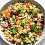 A bowl of quinoa Mediterranean salad with chickpeas and feta from the top view.