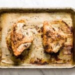 A woman is serving freshly roasted Baked Bone In Chicken Breast Recipe