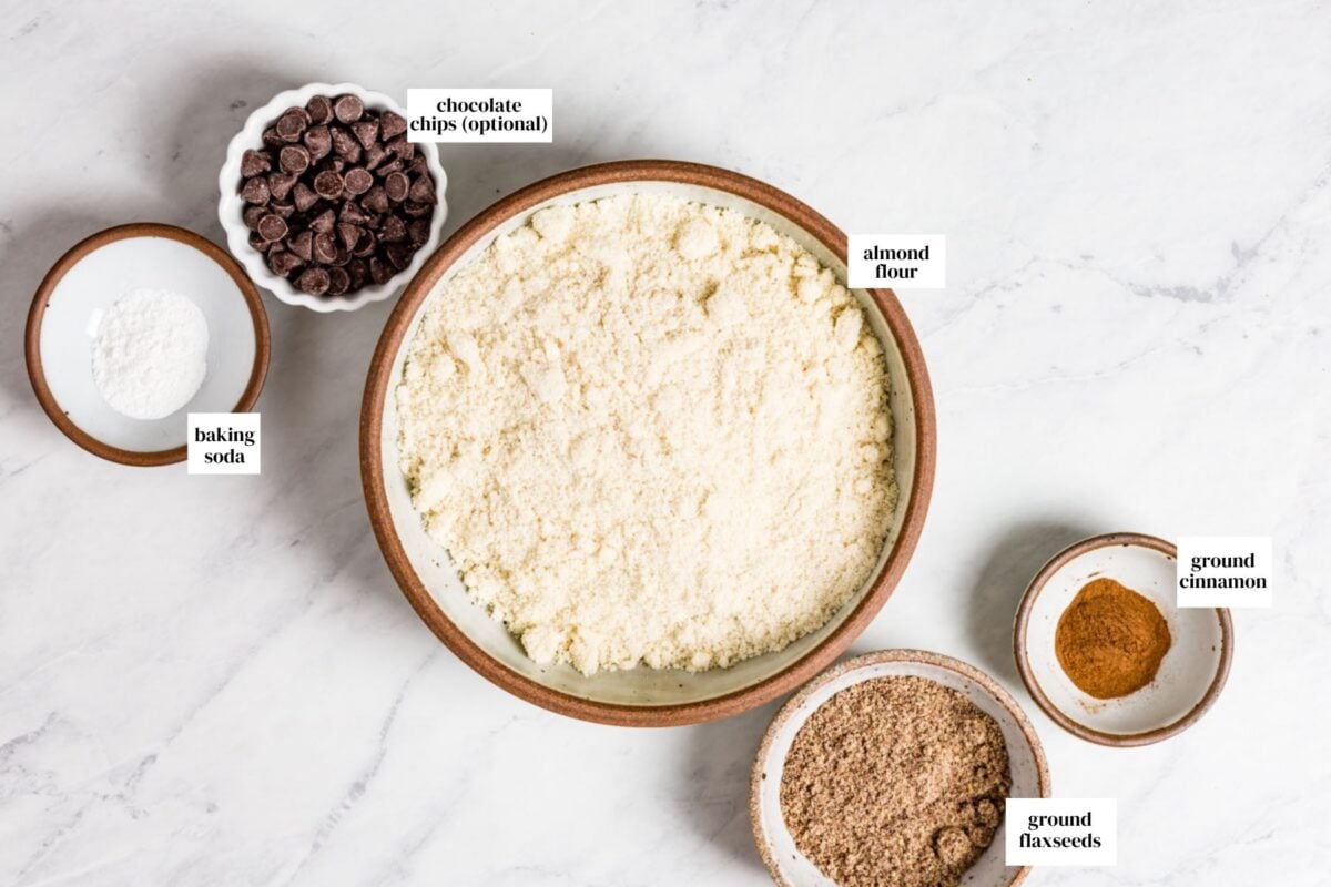 Dry ingredients measured and placed in small bowls from the top view.