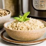 Pressure Cooker Quinoa in a bowl in front of an instant pot