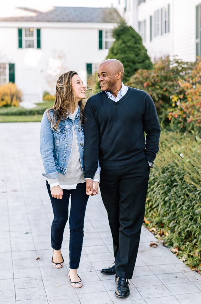 A man and a woman holding hands and walking