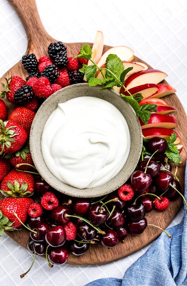 Yogurt Fruit Dip in a bowl served with various summer fruit.