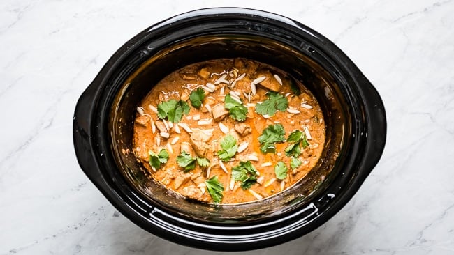 Indian Butter Chicken after it is cooker in the bowl of slow cooker