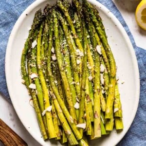 Baked Asparagus Recipe right out of the oven on an oval plate from the top view
