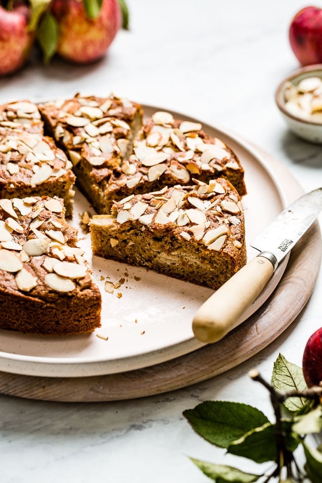 Almond Flour Apple Cake sliced with a knife on the side