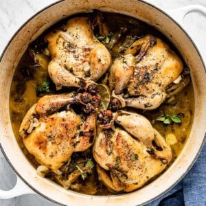roasted cornish game hens in a dutch oven top view