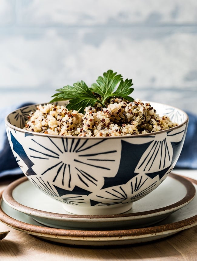 Cooked Quinoa in a bowl garnished with parsley