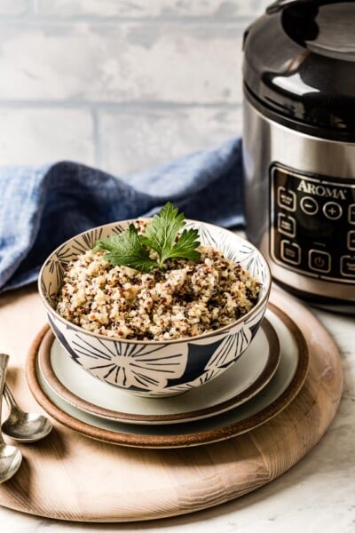 Quinoa Cooked in a rice cooker in a bowl garnished with parsley