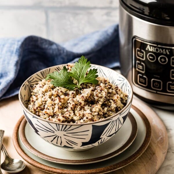 Quinoa Cooked in a rice cooker in a bowl garnished with parsley