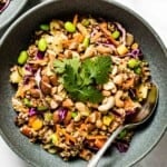 Crunch Thai quinoa salad from the top view with a spoon on the side