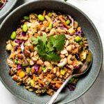 Thai Quinoa Salad in a bowl with a spoon on the side