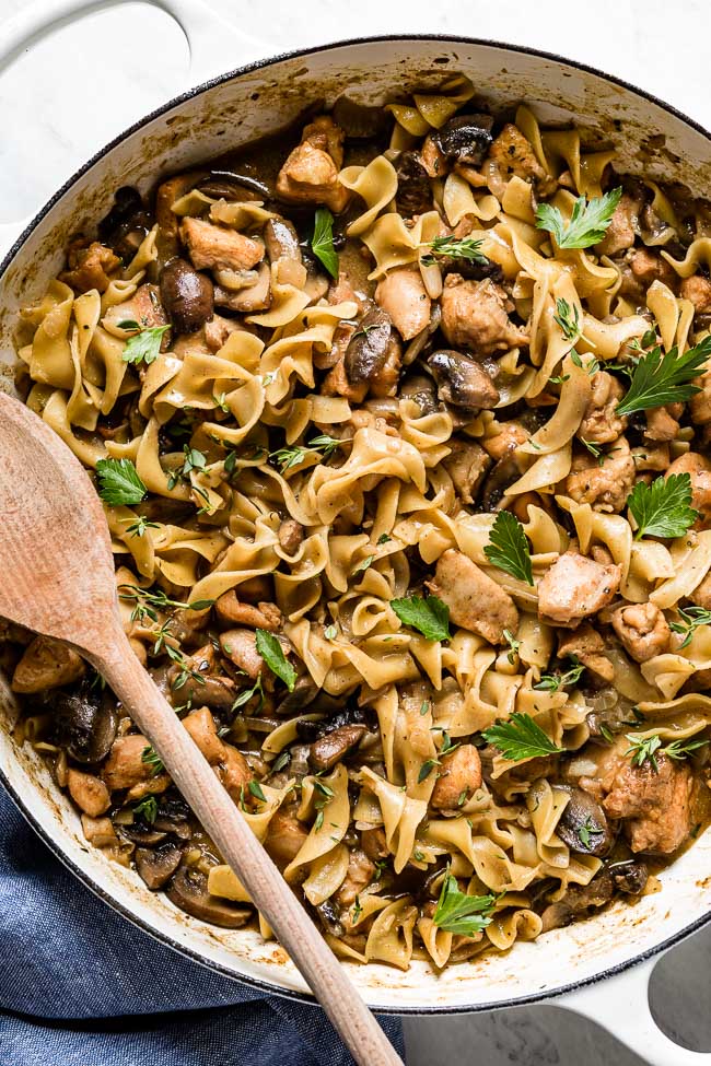 Chicken Stroganoff recipe Chicken stroganoff with mushrooms and egg noodles in a large pan