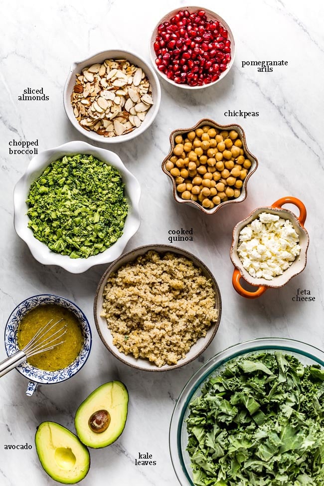 Ingredients for the salad recipe placed on a marble counter from the top view