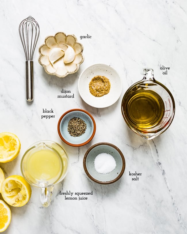 Lemon vinaigrette ingredients on a marble counter