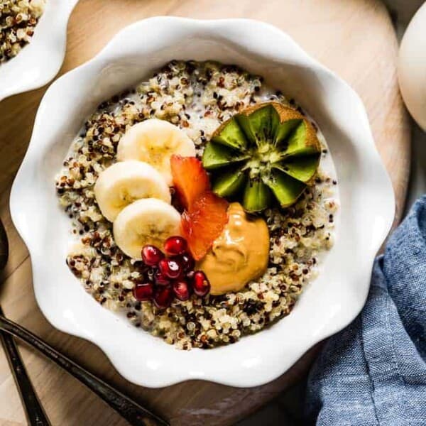 Quinoa porridge topped off with fruit in a bowl