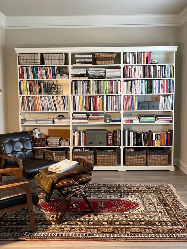 Reading room with bookshelves and a couch