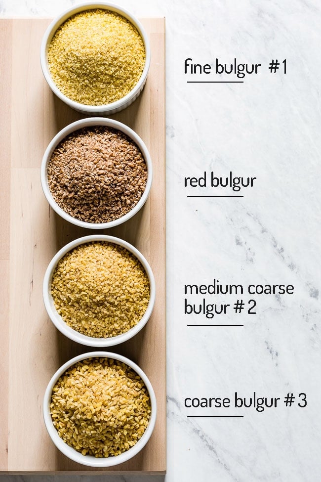 Various sizes of bulgur wheat placed in bowls with their names written next to them.