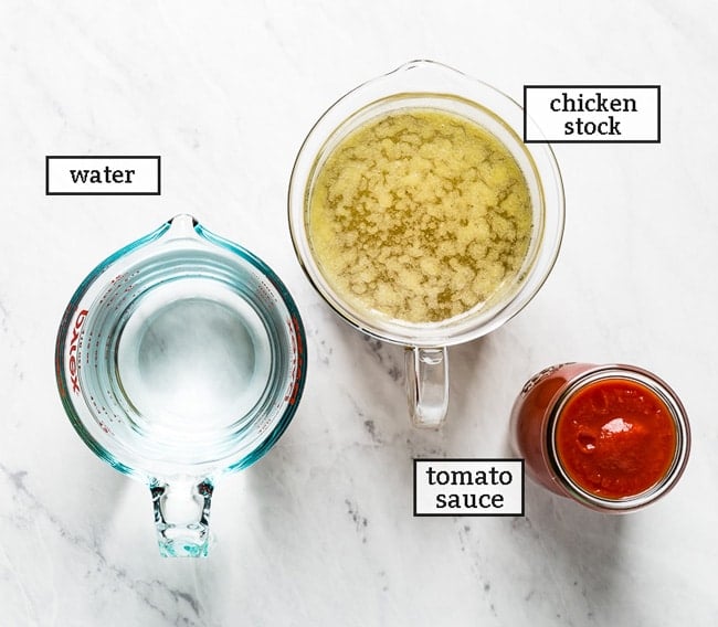 The liquid portion of the recipe ingredients water, chicken stock and tomato sauce