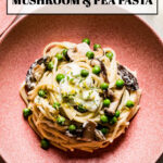 a bowl of mushroom pea pasta from the top view