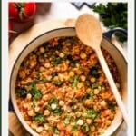 Tomato and bulgur pilaf in a pot with text on the image.
