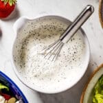 Creamy Poppy Seed Salad Dressing in a bowl with a whisk