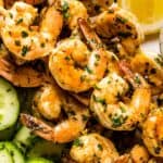 Grilled Shrimp on a plate with cucumber and lemon