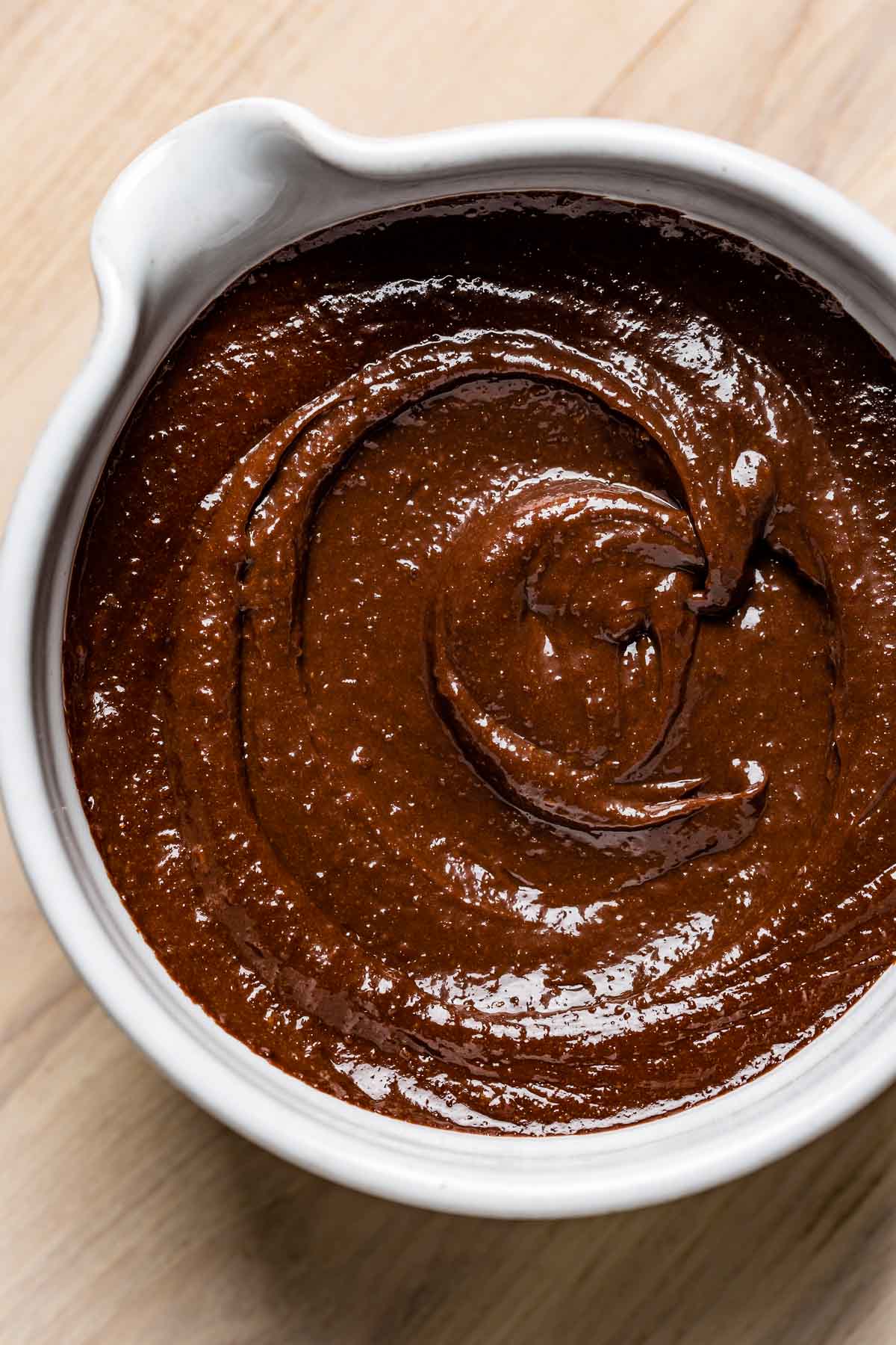 A bowl of paleo frosting in a bowl from top view