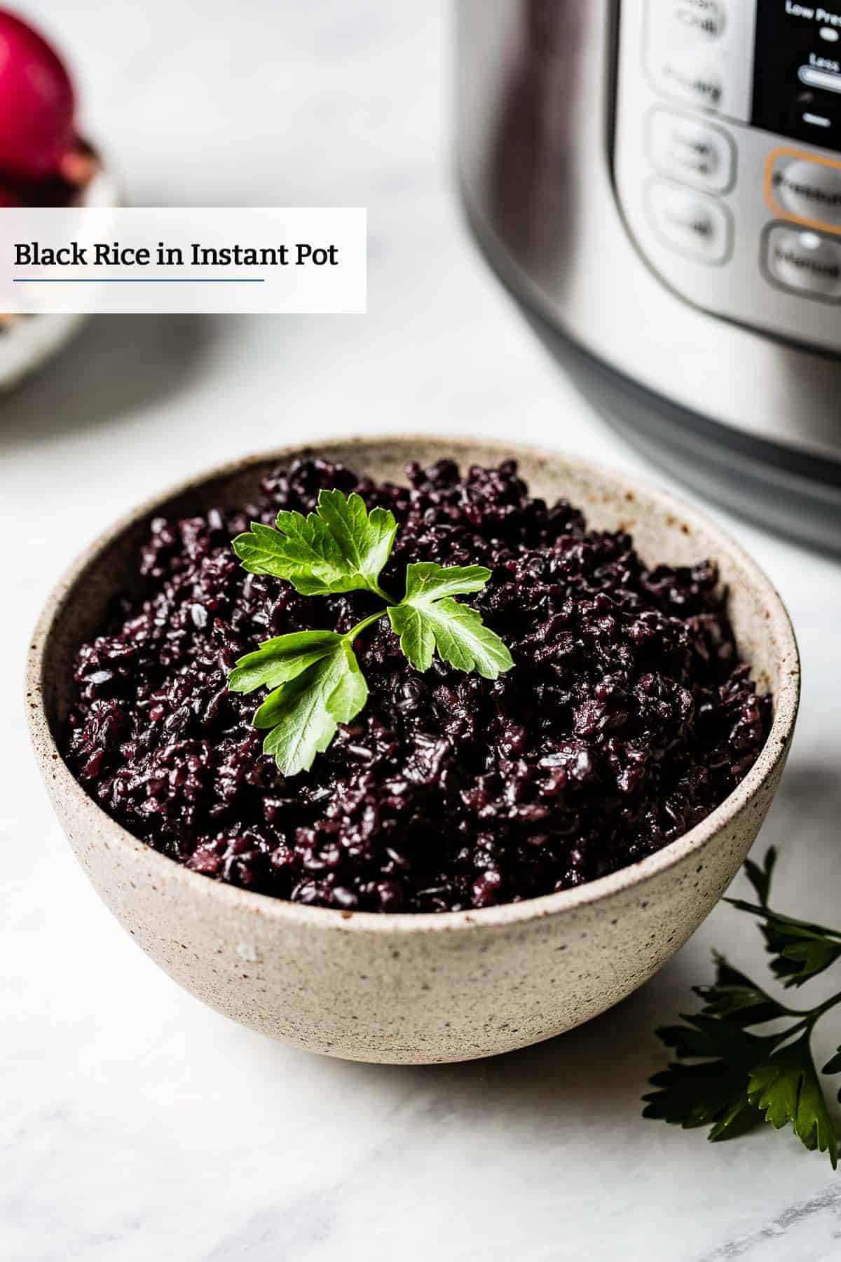 Instant pot black rice in a bowl with parsley as garnish