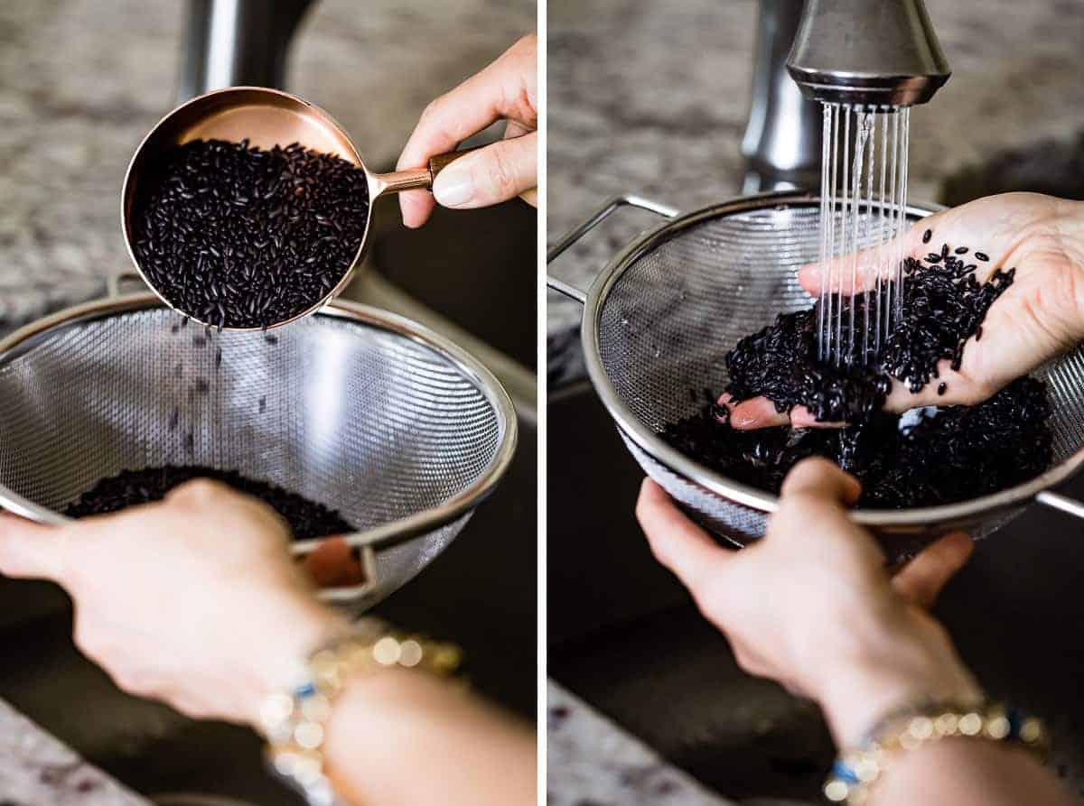 Person washing black rice in sink using a fine mesh strainer