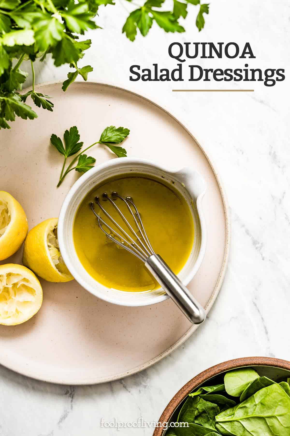 a bowl of lemon vinaigrette with a whisk in the bowl