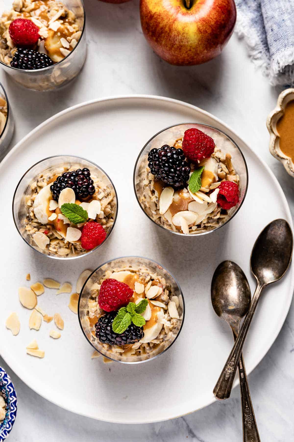 Muesli yogurt breakfast in glass topped off with fruit from top view