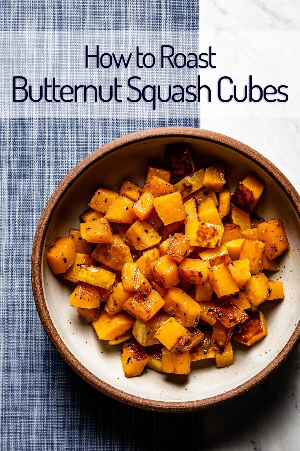 roasted butternut squash cubes in a bowl with text on the image