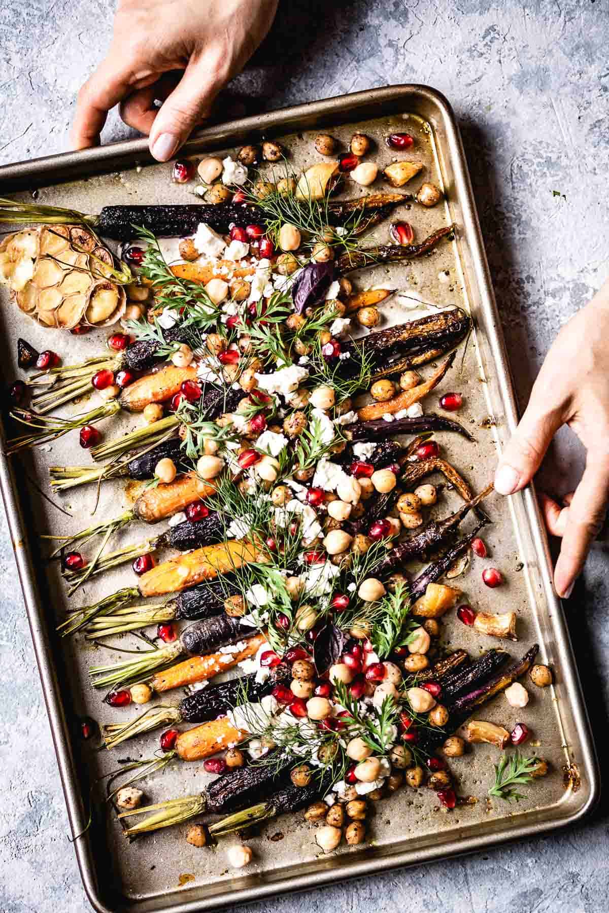 whole roasted carrots on a sheet pan