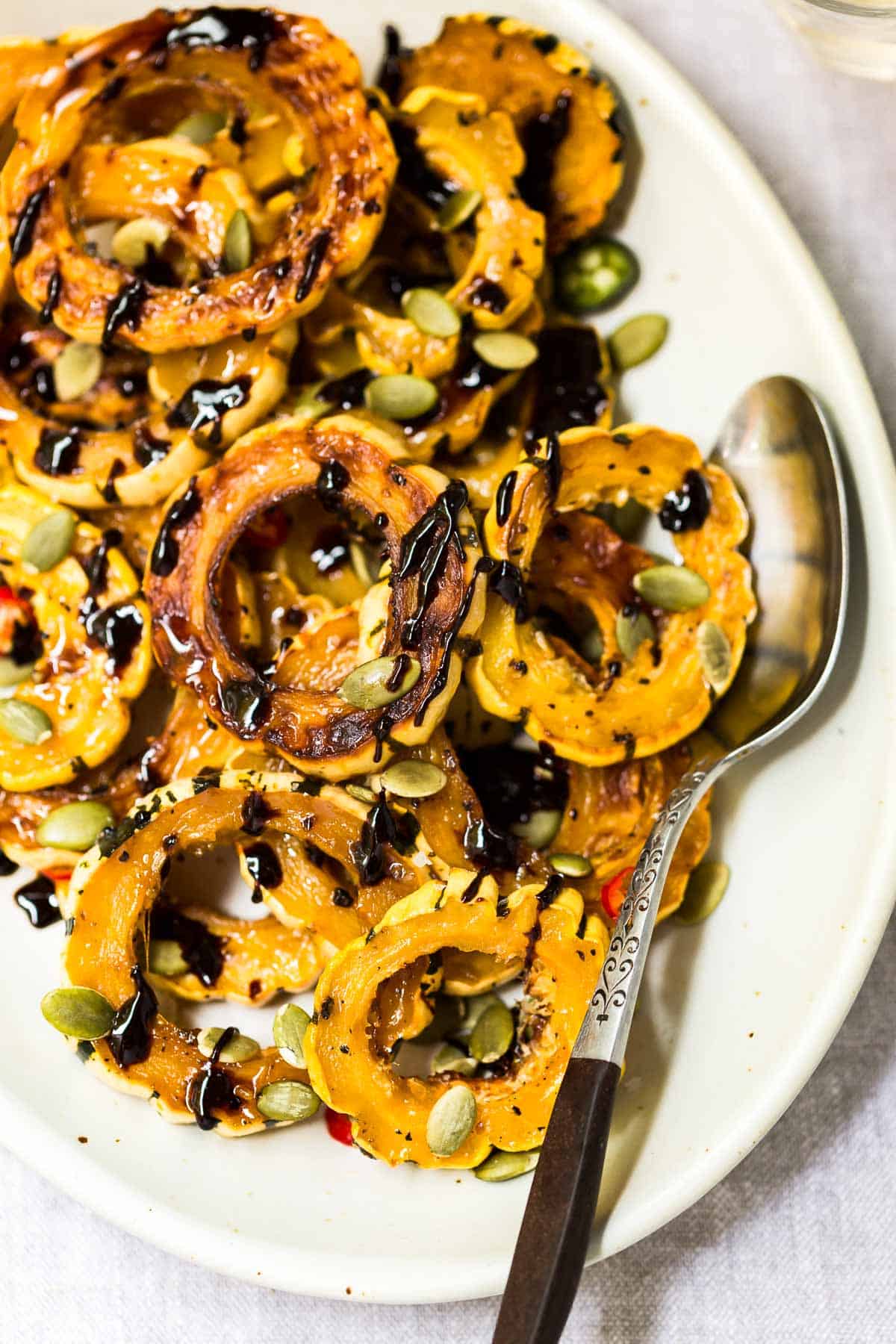 Roasted Delicata Squash garnished with pepitas