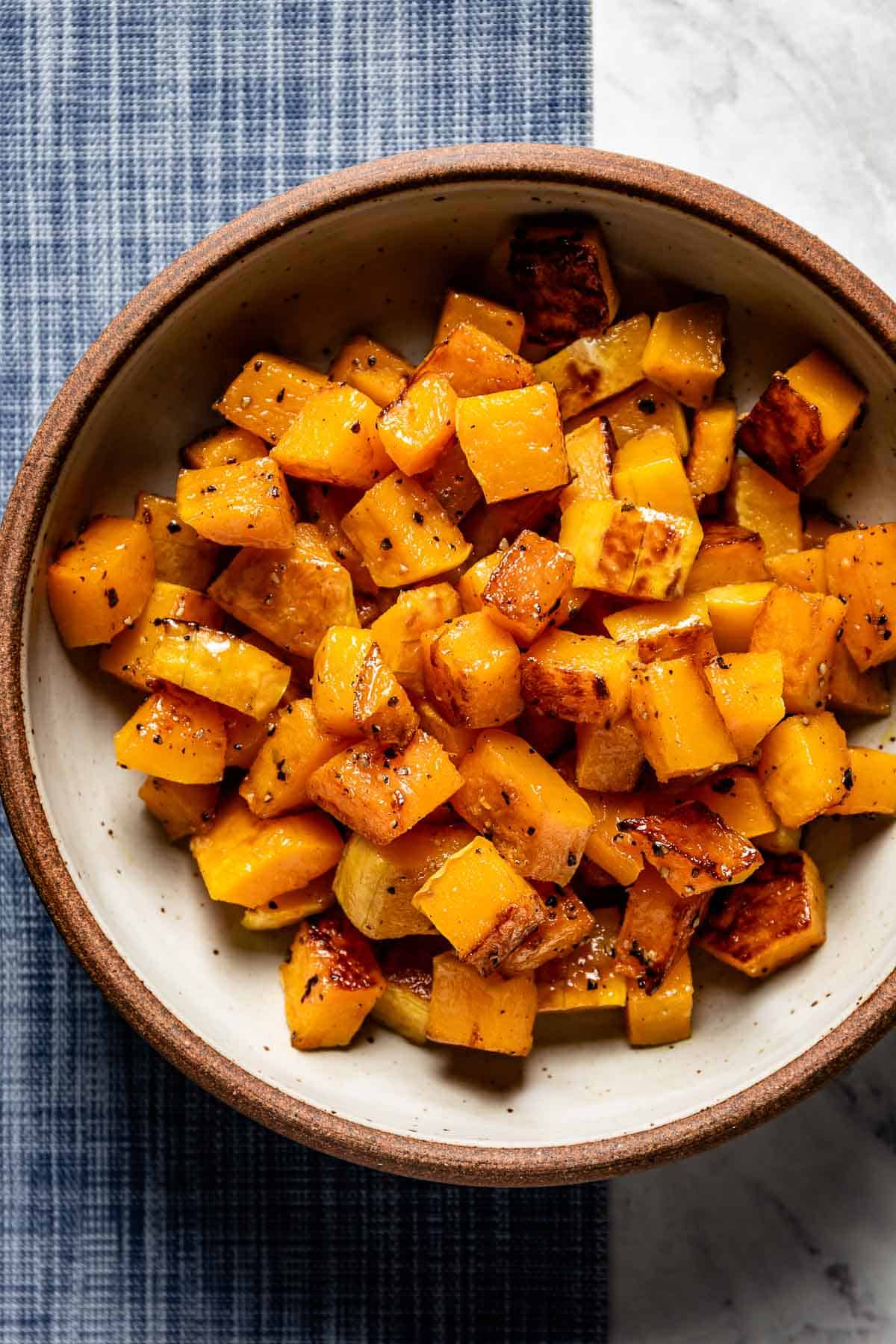 a bowl of roasted butternut squash cubes from the top