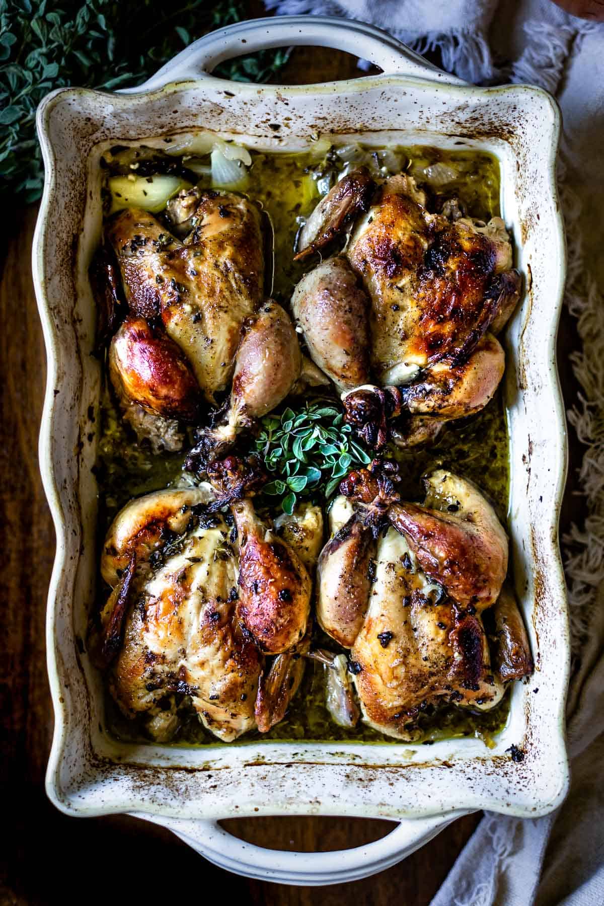 Roasted Cornish hens in a large baking dish