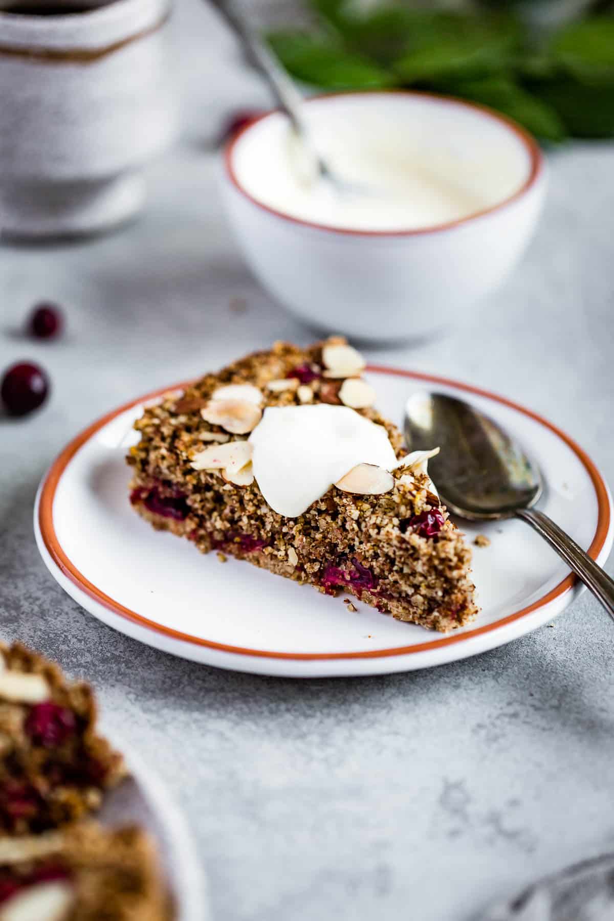 Vegan cranberry tart topped with creme fraiche