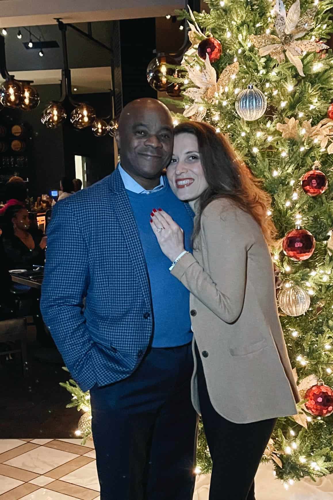 Dwight and Aysegul in front of a Christmas tree