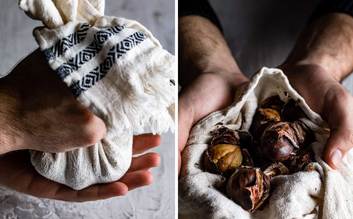 person holding roasted nuts in a kitchen towel in his hands
