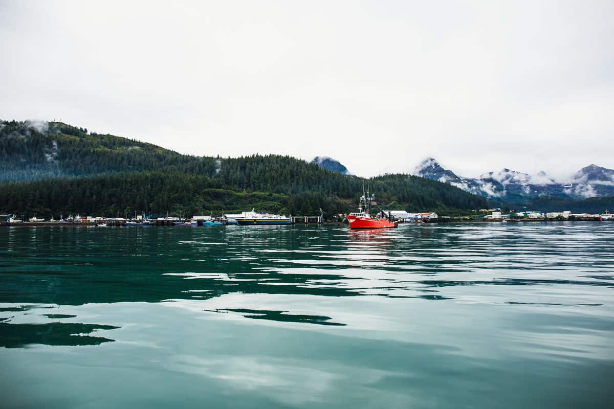 Alaska mountains and a red boat